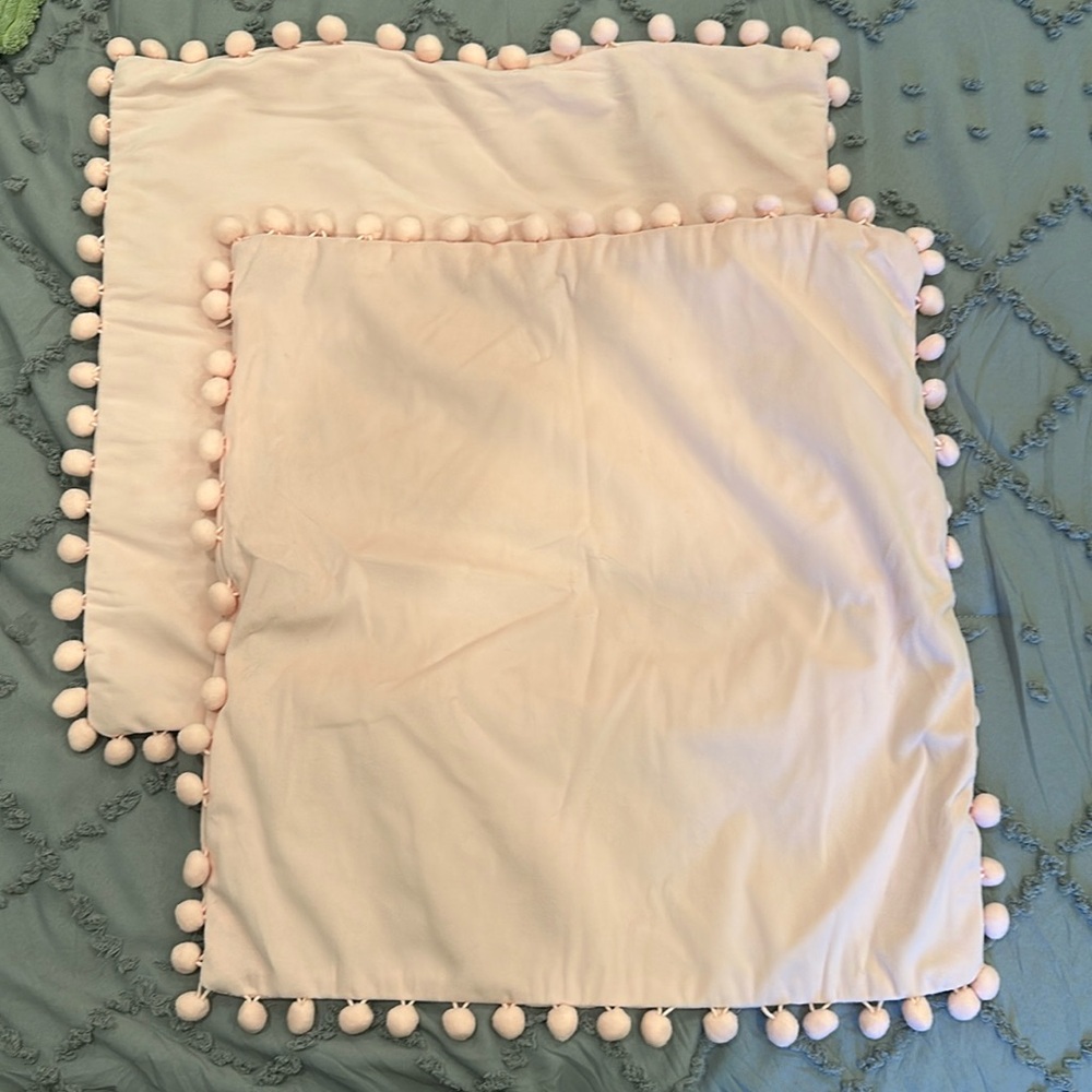 NWOT pair of pink pillow covers with pompoms